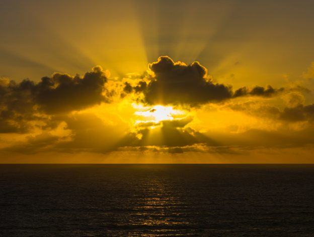 golden hour photography of sky above ocean