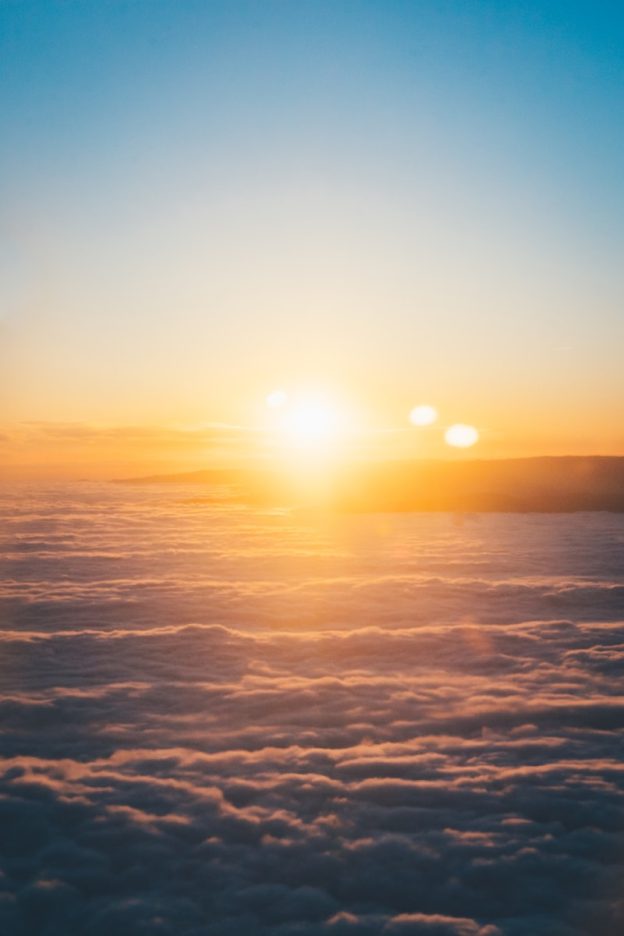 clouds and sun during sunset